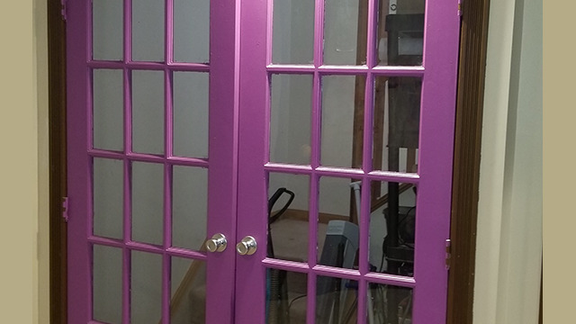Painted double doors in the basement.