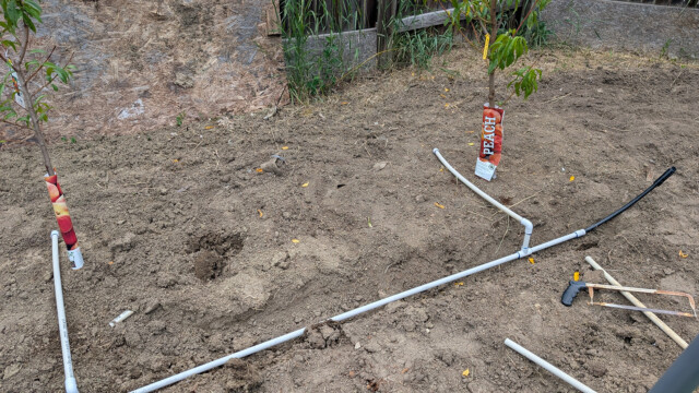 Ground and water line area before the garden installation progressed.