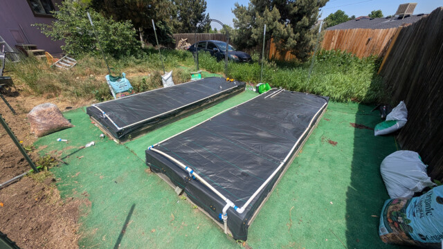 Raised beds and landscape fabric during the garden project.