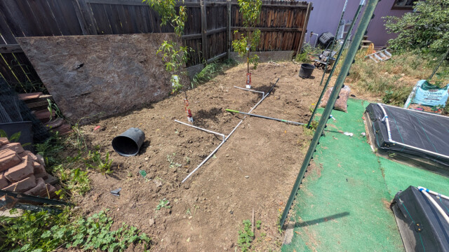 Line routing through the garden area during installation.