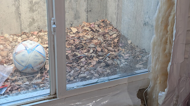 Interior view of the original basement window before the repair.