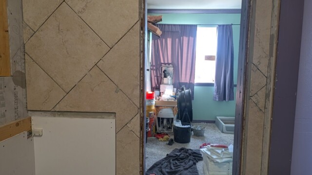 Bathroom floor and doorway as tile work progressed.