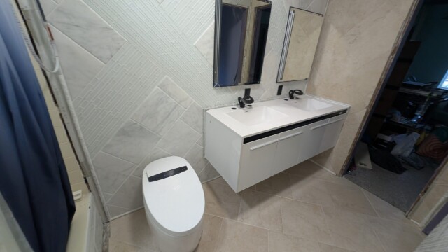 Vanity and mirror installed in the bathroom.