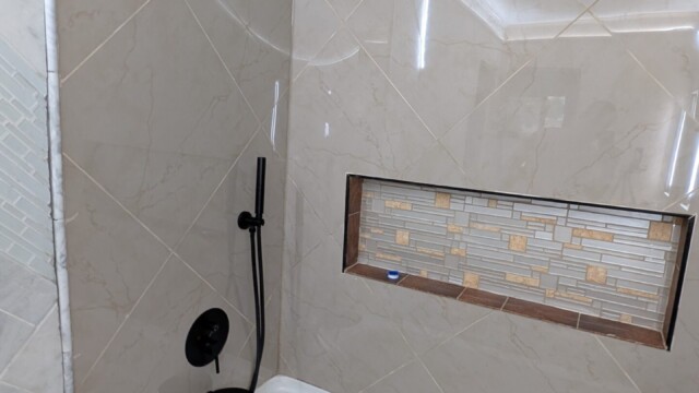 Shower wall tile and niche taking shape.