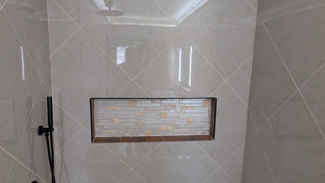 Finished shower wall and tiled niche.